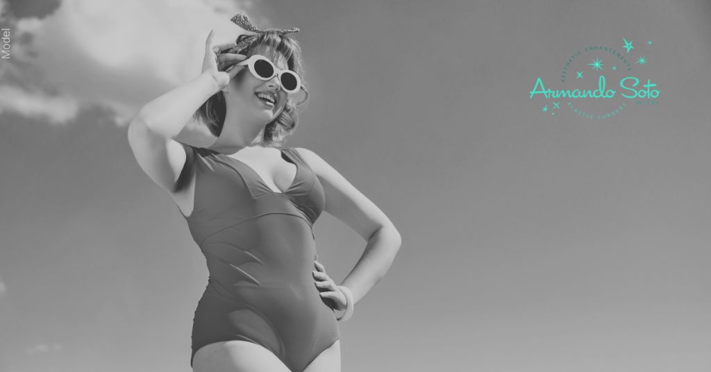 Pin up girl with one-piece bikini smiling with sunglasses on (MODEL)